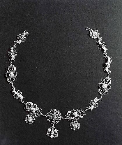 Necklace Formed of Fifteen Dress Ornaments