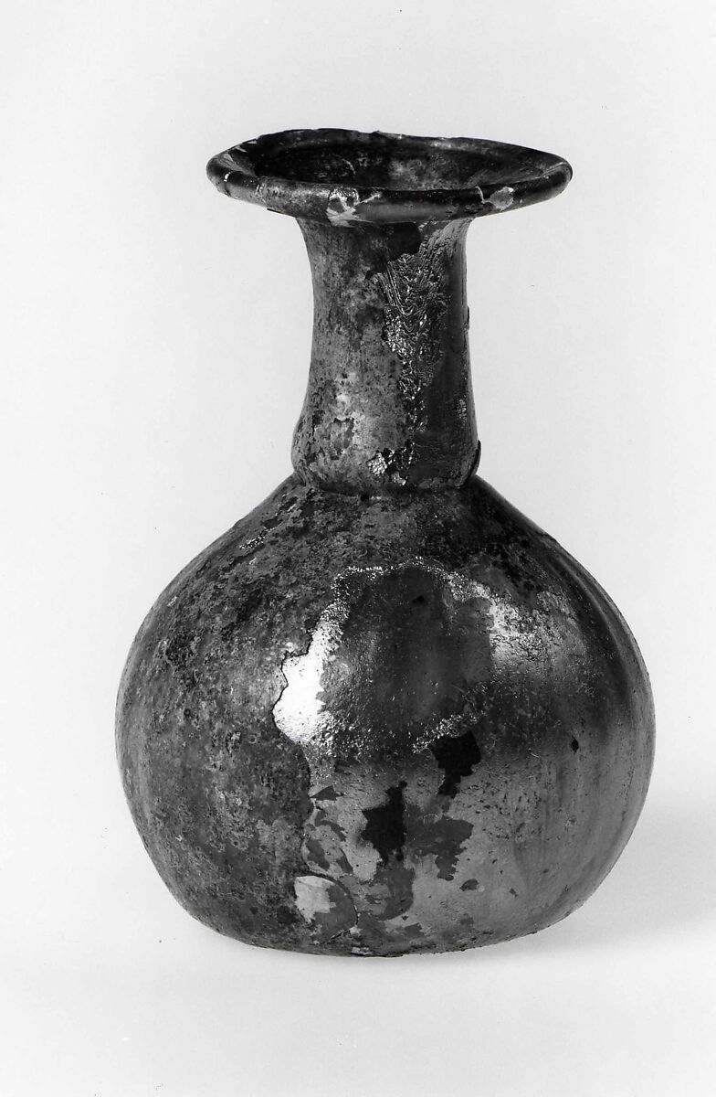 Dropper flask, Almost colorless glass. Blown (the body blown in a dip mold), tooled, the rim finished at the furnace., Roman 