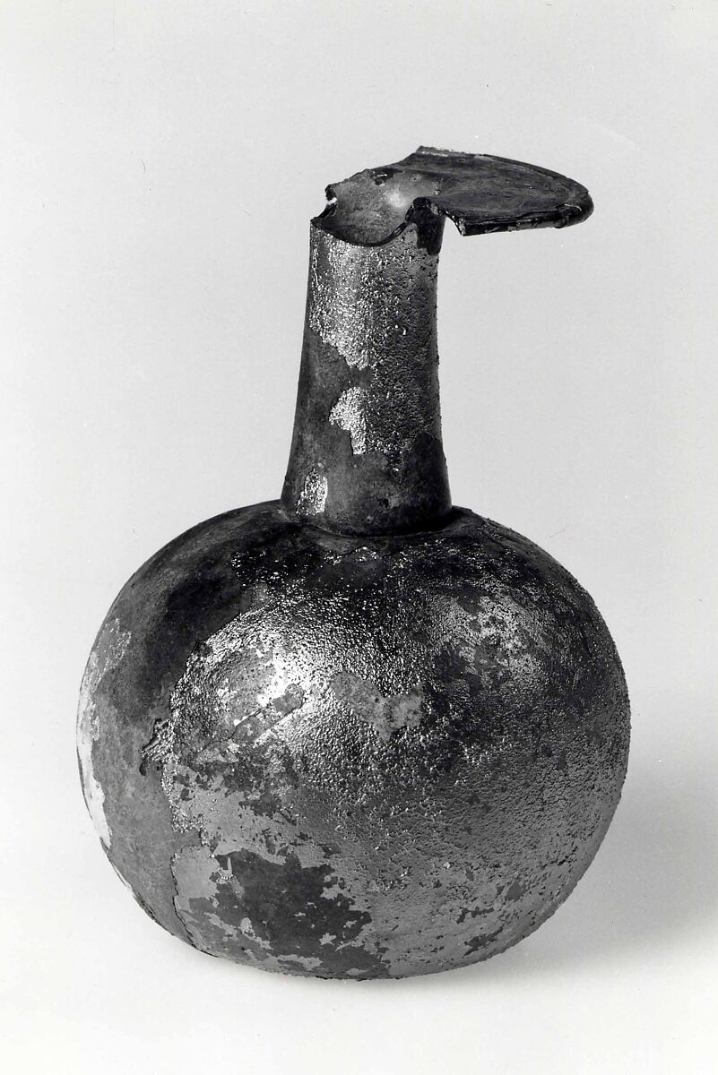 Dropper flask, Either colorless or transparent very pale green or very pale yellowish brown glass. Blown (the body blown in a dip mold), tooled, the rim finished at the furnace., Roman 