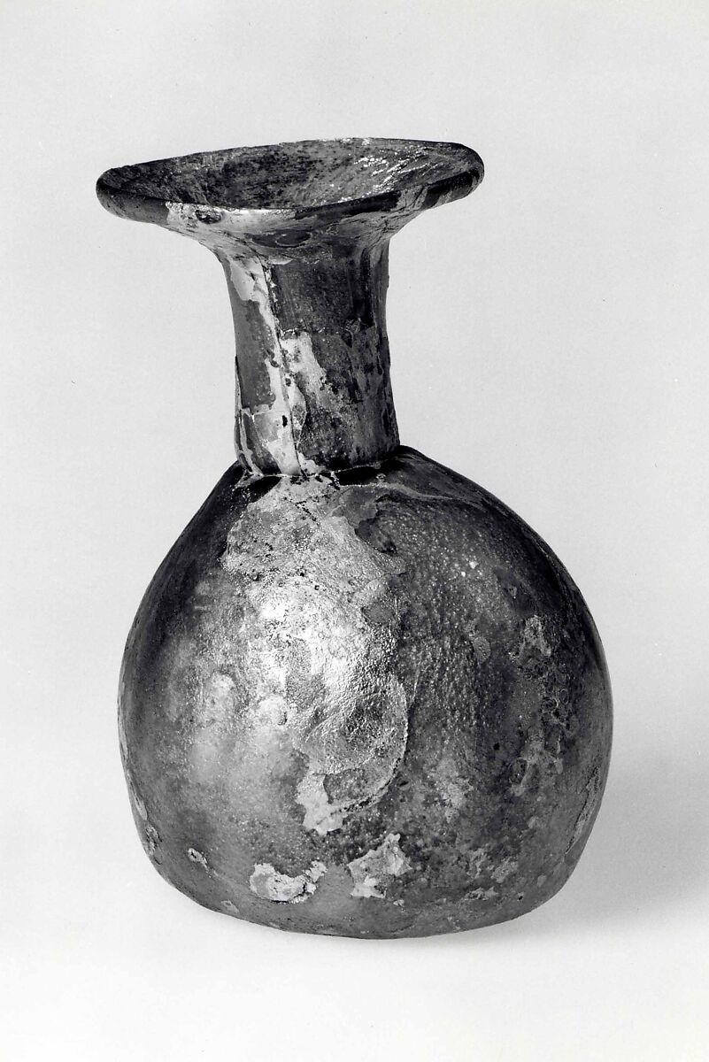 Dropper flask, Almost colorless glass with a pale green or yellow tint.  Blown (the body blown in a dip mold), tooled, the rim finished at the furnace., Roman 