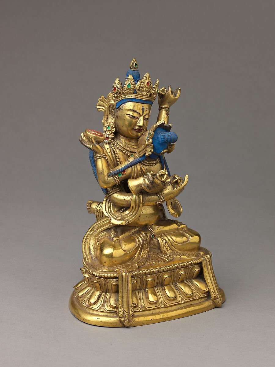 Buddhist deity Vajradhara in union with his consort Prajnaparamita, Gilt brass with copper base and applied color., probably Chinese or Tibetan
