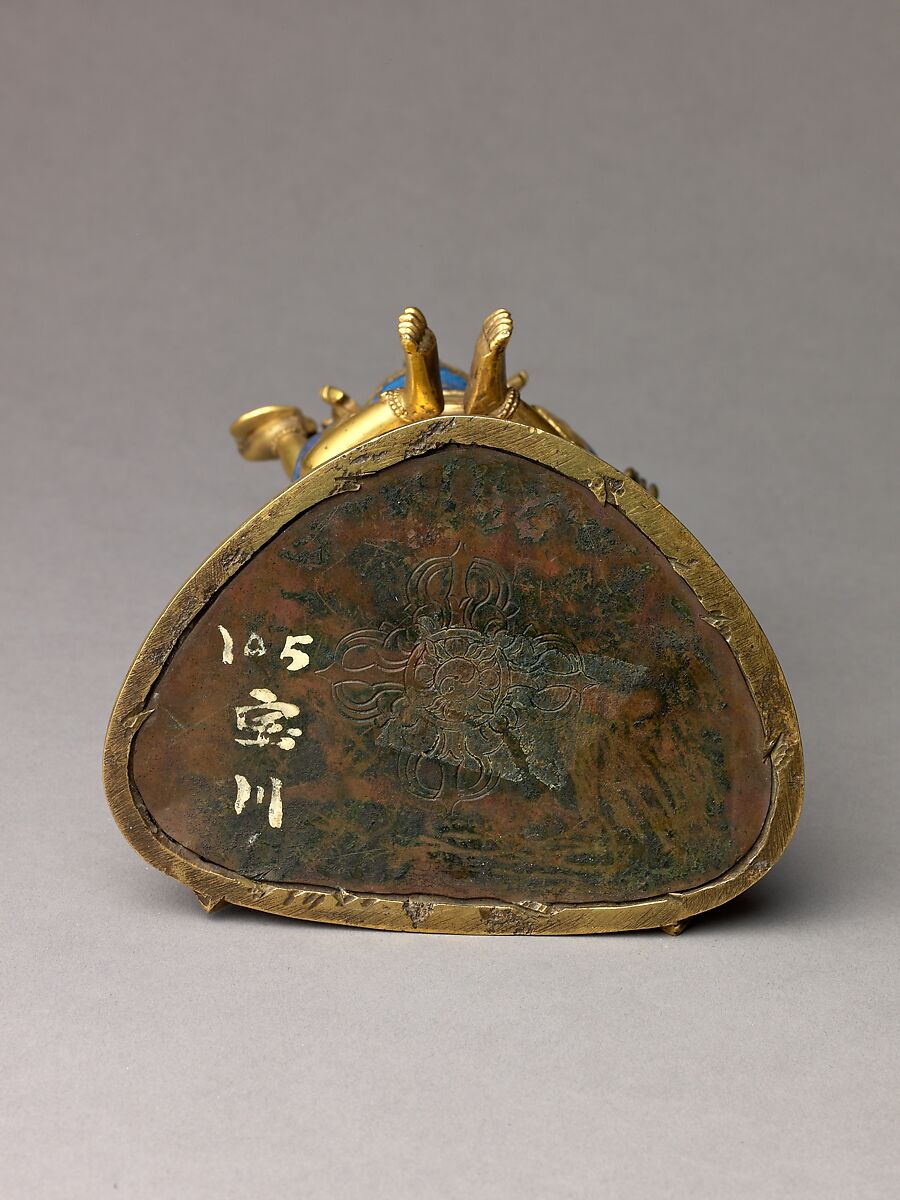 Buddhist deity Vajradhara in union with his consort Prajnaparamita, Gilt brass with copper base and applied color., probably Chinese or Tibetan