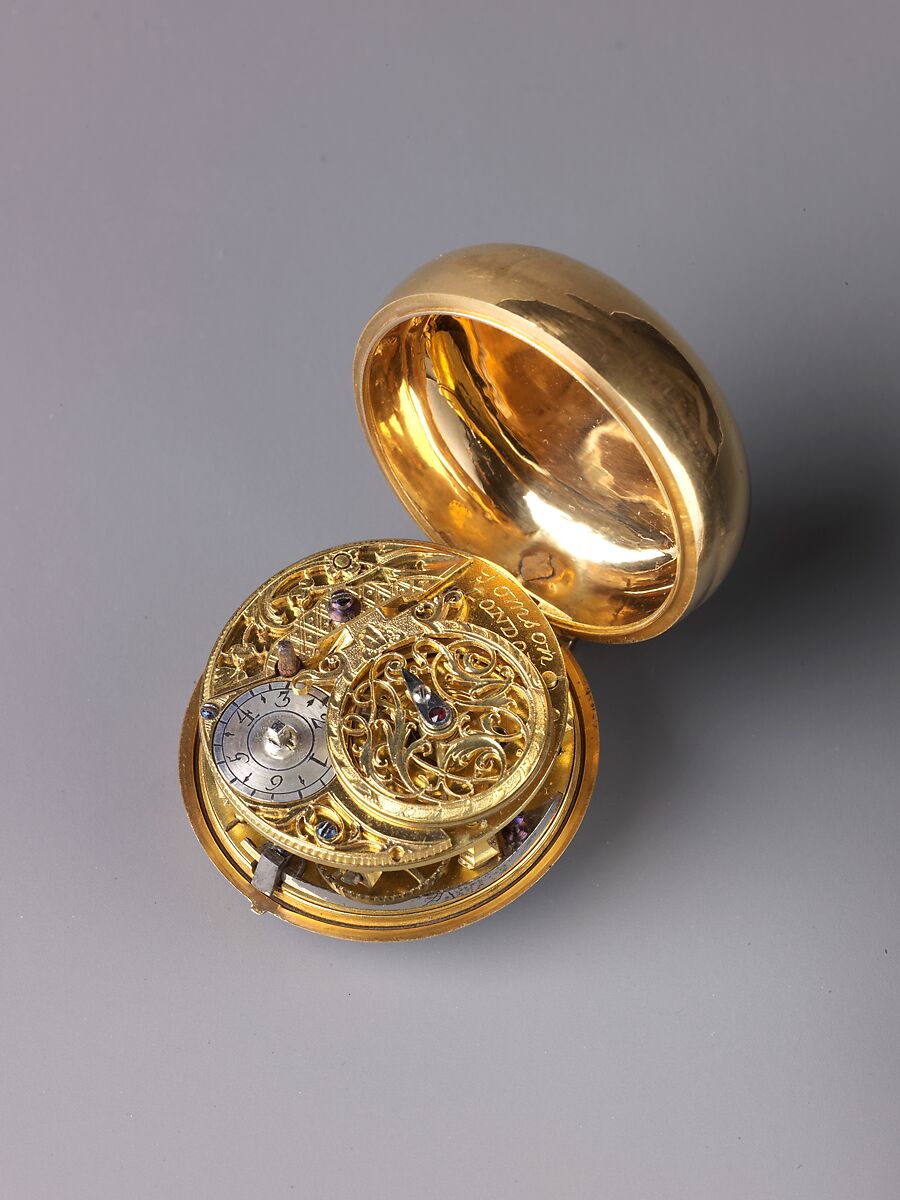 Watch Painted with a Pastoral Scene, Outer case of painted enamel on gold. Inner case of gold with an unidentified
maker’s mark consisting of the letters ic over b below a
coronet (incuse) on the interior and an eagle’s head, a French
guarantee mark for gold in use between 1 January 1847 and
1 July 1919 on the pendant. Dial of gold and white enamel
with black numerals; silver hands set with diamond chips.
Movement of gilt brass and steel. Movement signed (on the
back plate): Tomson/london., French and probably Swiss