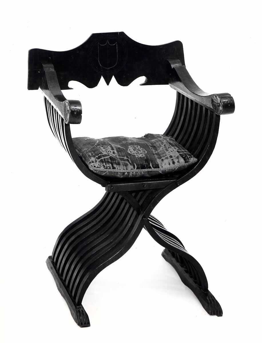 Folding armchair (sedia a Savonarola type), Walnut, partly turned and carved; green velvet., Italian