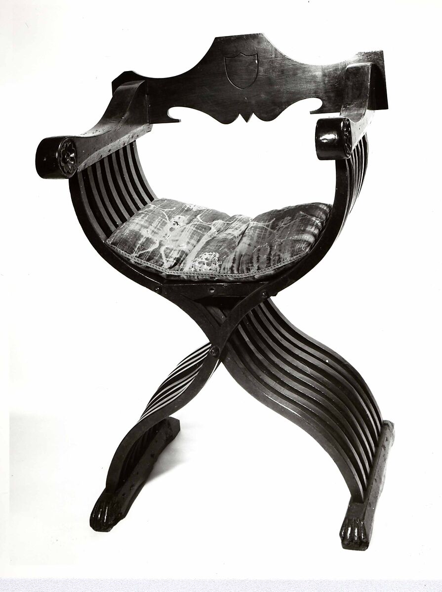 Folding armchair (sedia a Savonarola type), Walnut, partly turned and carved; green velvet., Italian