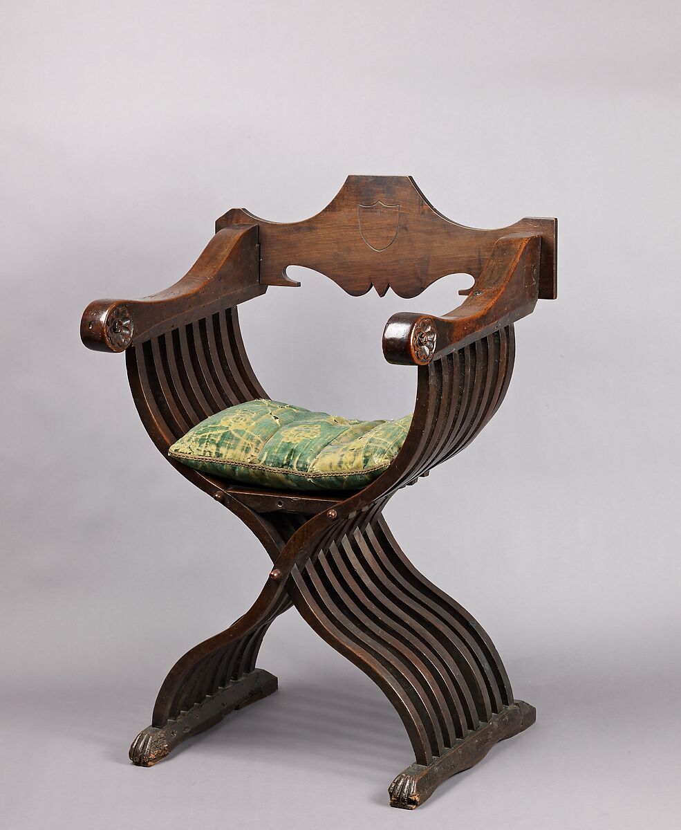 Folding armchair (sedia a Savonarola type), Walnut, partly turned and carved; green velvet., Italian 