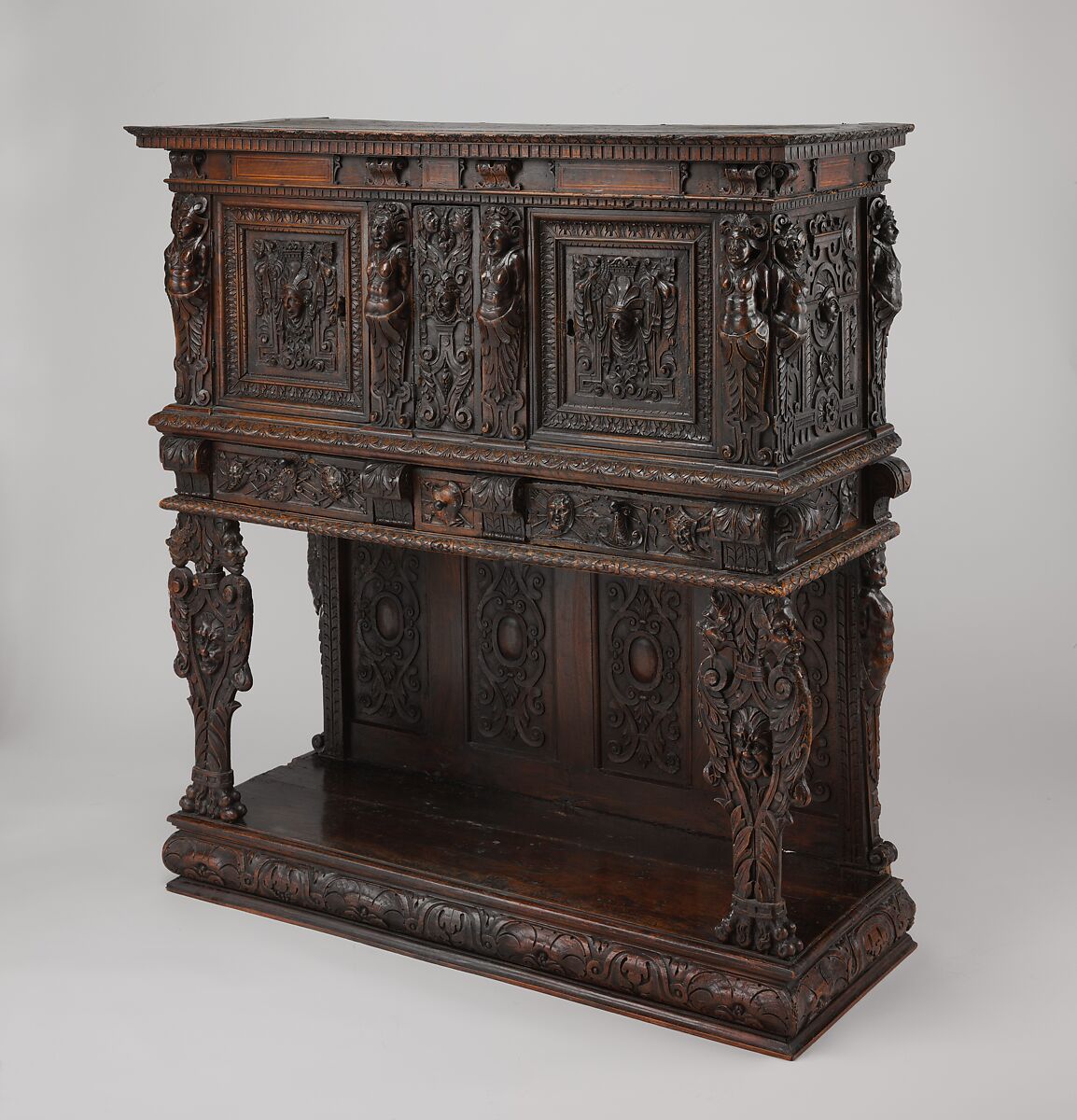 Dresser (Dressoir aux harpies), Carved walnut with interior elements of oak, pine; iron locks and hinges., French (Ile-de-France or Burgundo-Lyonnais) 