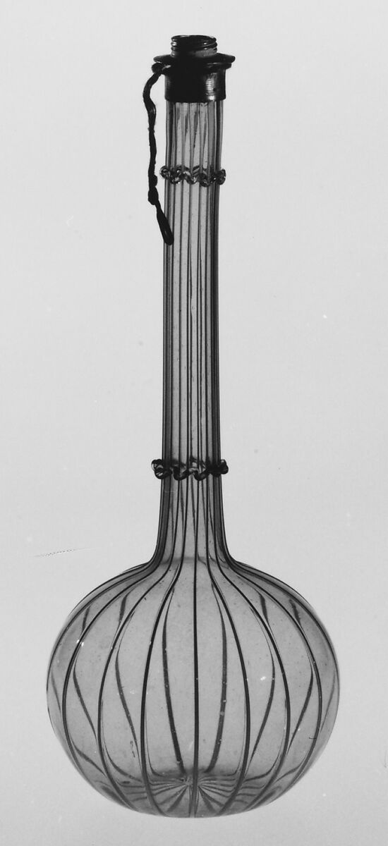 Bottle, Antonio Salviati  Italian, Colorless (slightly gray) and opaque white nonlead glass; pewter mount. Blown, "vetro a fili", trailed.