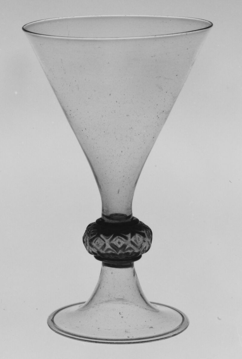 Goblet, Tyrol, Colorless (dark gray) bubbly nonlead glass. Blown, pattern molded, gilt., Façcon de Venise, probably Tyrolean (Hall) or French