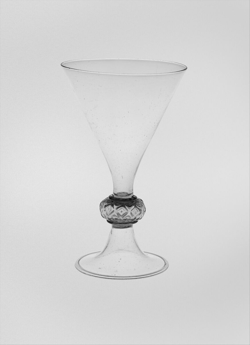 Goblet, probably from the Tyrol, Colorless (dark gray) bubbly nonlead glass. Blown, pattern molded, gilt., Façcon de Venise, probably Tyrolean (Hall) or French