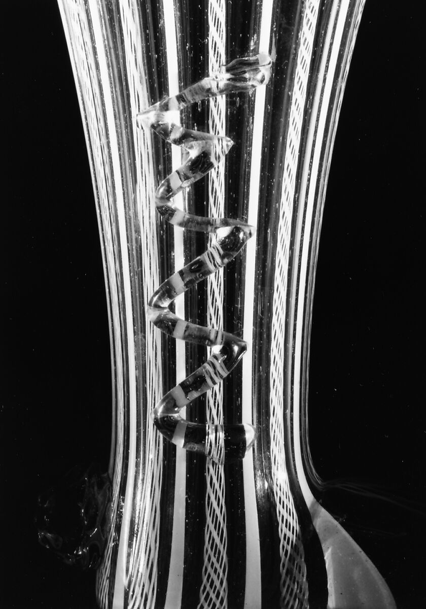 Boot glass, Colorless (slightly tan) and opaque white nonlead glass. Blown, "vetro a retorti", trailed, applied and impressed parts, gilt., Venetian or façon de Venise, probably south Lowlands or Germany