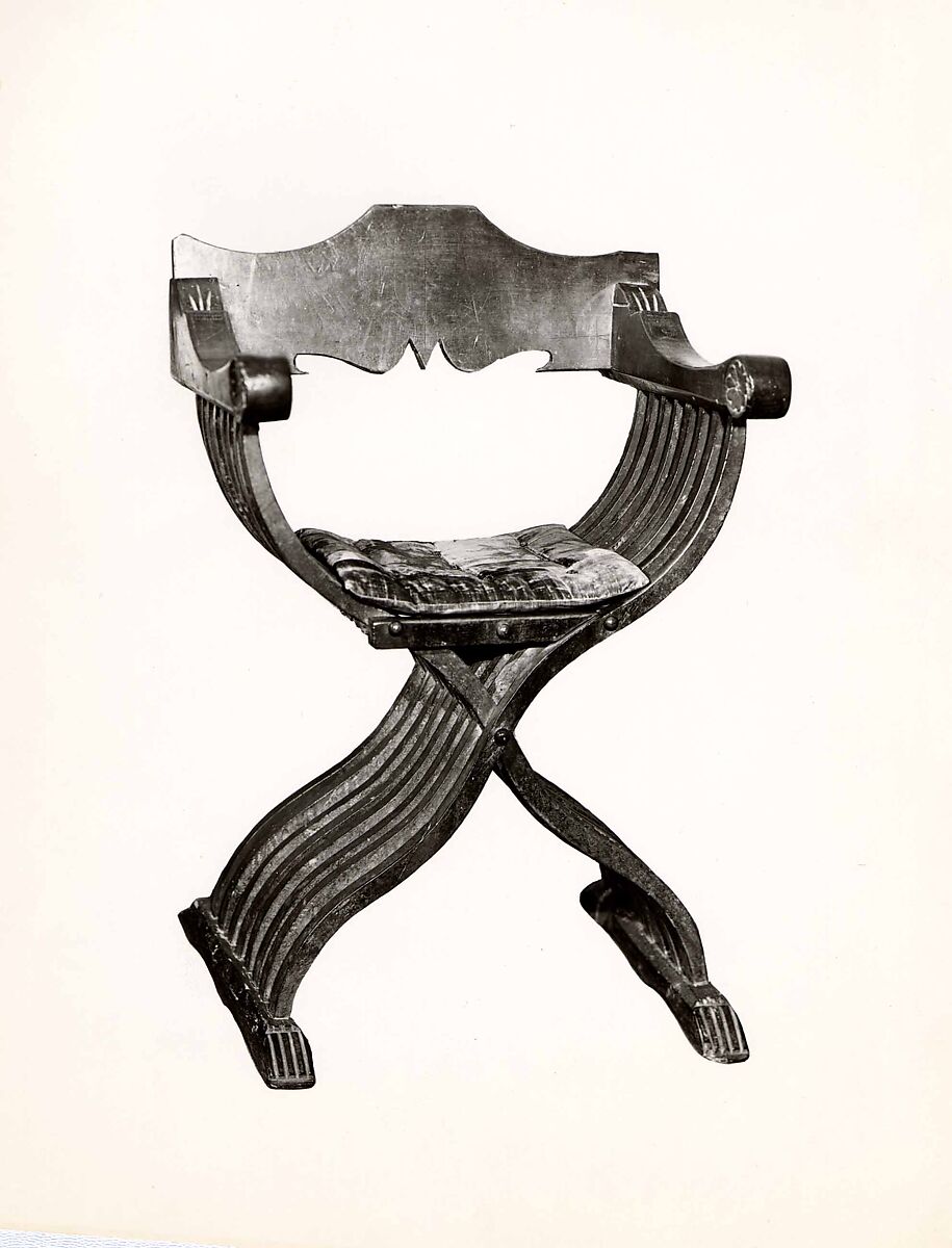 Folding armchair (sedia a Savonarola type), Walnut, partly turned and carved; red plain velvet., Italian