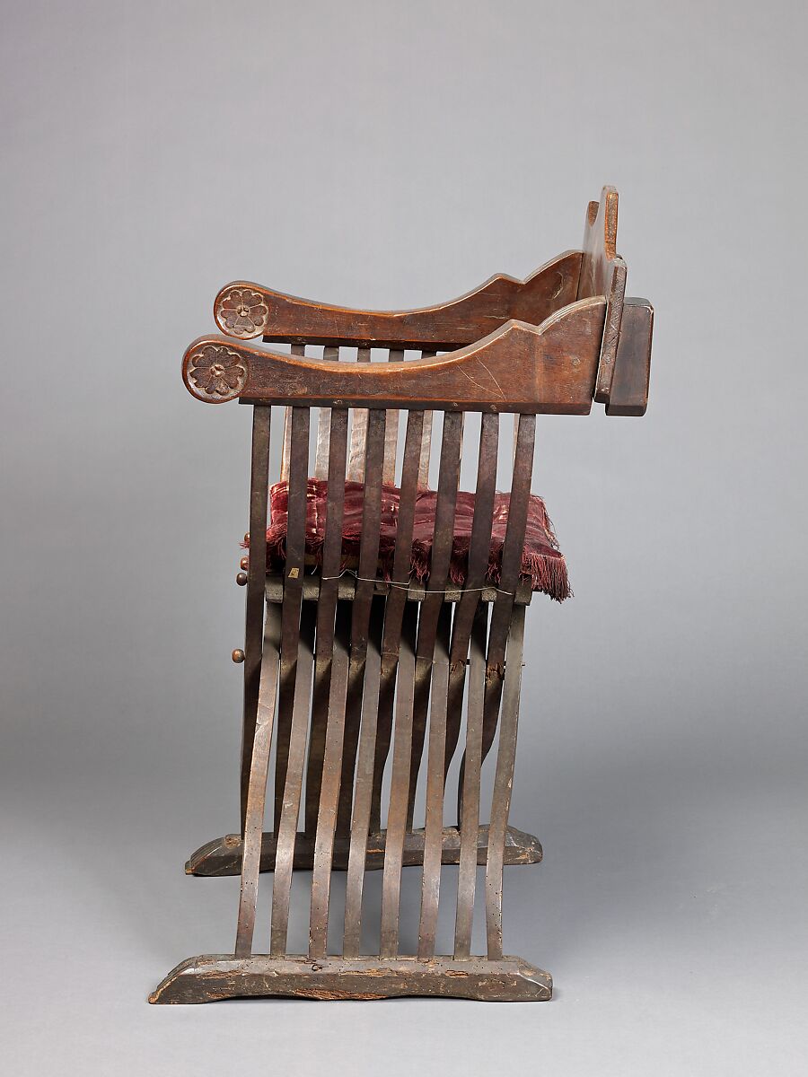 Folding armchair (sedia a Savonarola type), Walnut, partly turned and carved; red plain velvet., Italian