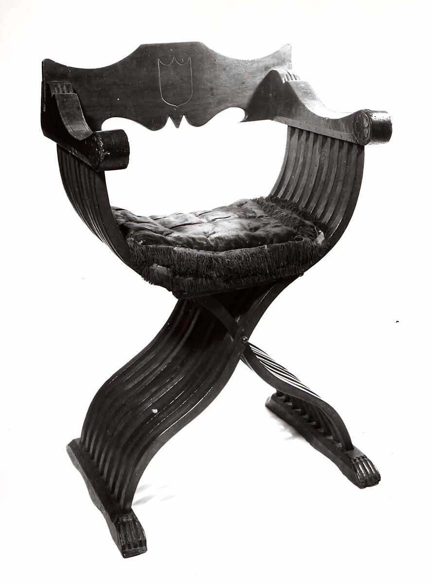 Folding armchair (sedia a Savonarola type), Walnut, partly turned and carved; red plain velvet., Italian