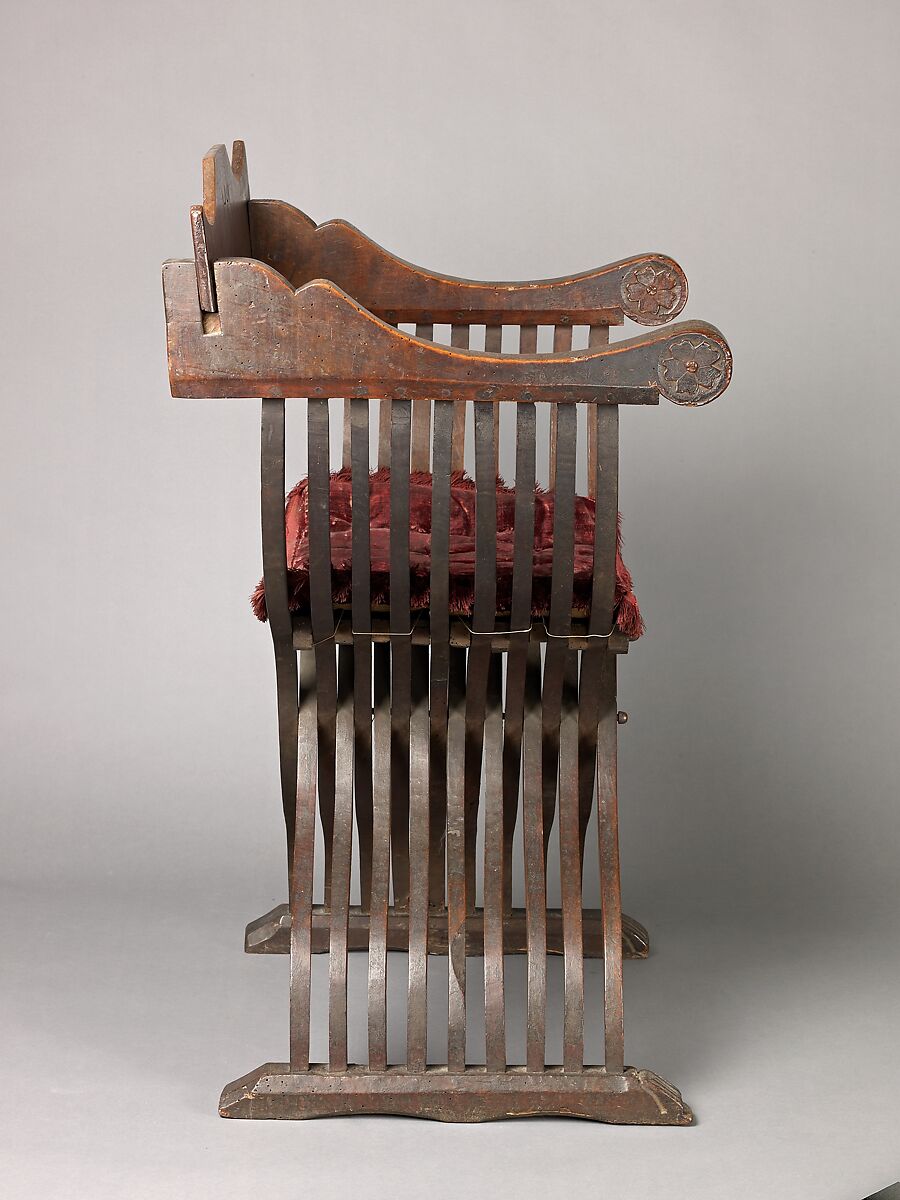Folding armchair (sedia a Savonarola type), Walnut, partly turned and carved; red plain velvet., Italian