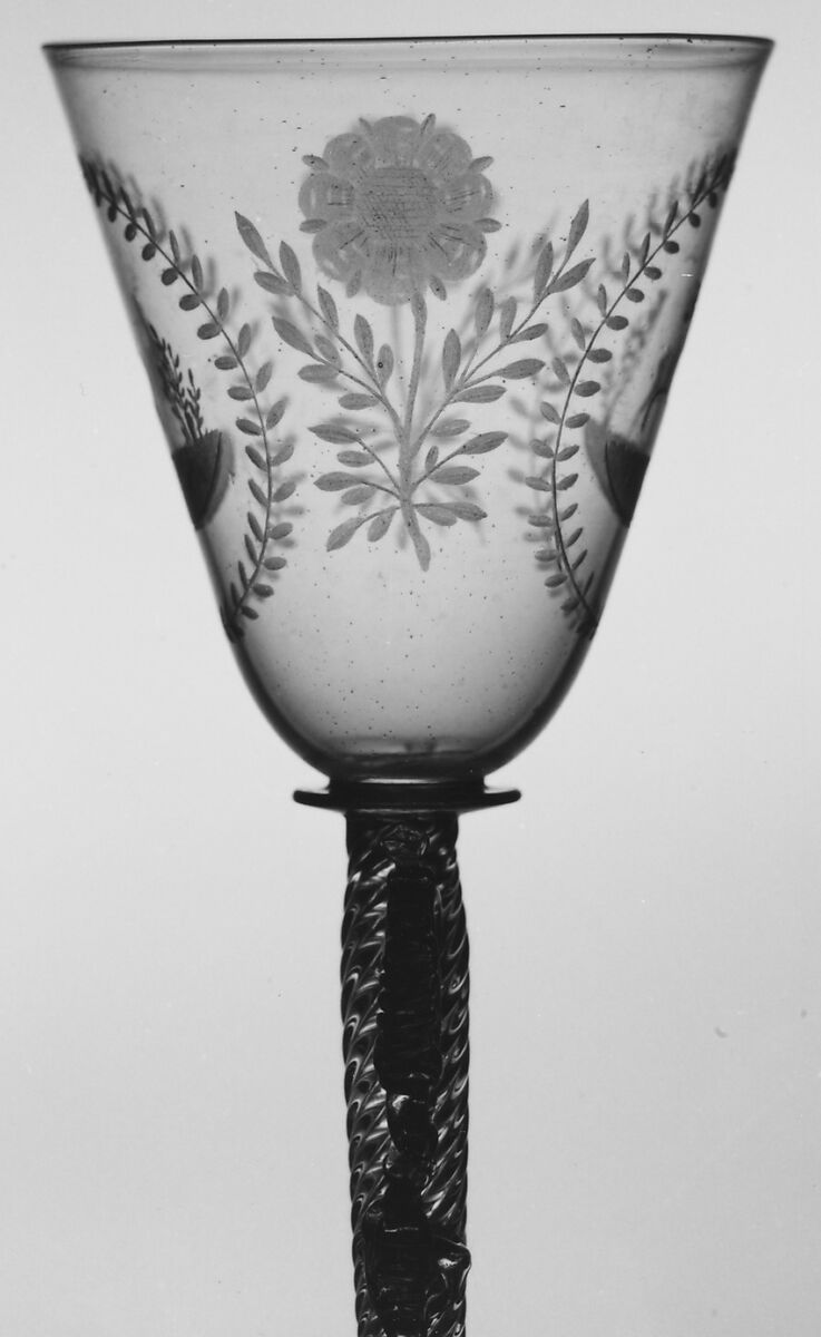 Wineglass, Colorless (slightly tan) nonlead glass. Blown, pattern molded, trailed, pincered, wheel-engraved., probably Italian (Venice)