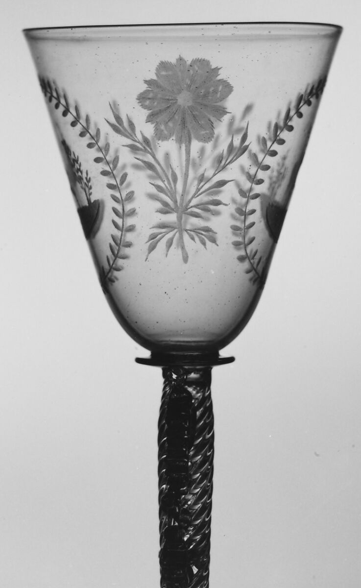 Wineglass, Colorless (slightly tan) nonlead glass. Blown, pattern molded, trailed, pincered, wheel-engraved., probably Italian (Venice)