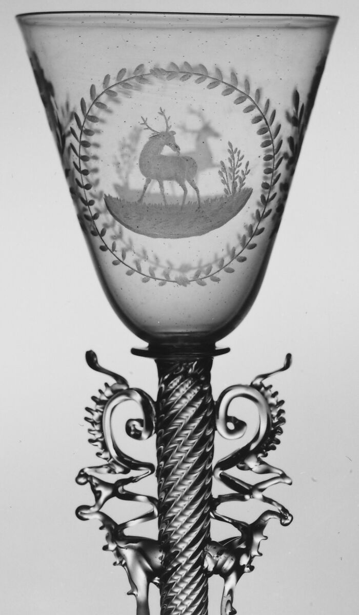 Wineglass, Colorless (slightly tan) nonlead glass. Blown, pattern molded, trailed, pincered, wheel-engraved., probably Italian (Venice)