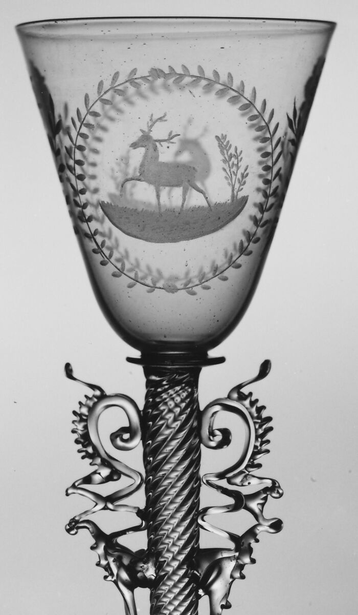 Wineglass, Colorless (slightly tan) nonlead glass. Blown, pattern molded, trailed, pincered, wheel-engraved., probably Italian (Venice)