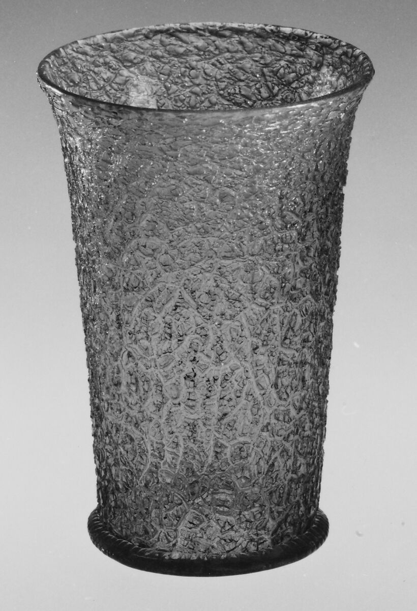 Beaker, Colorless (slightly tan) nonlead glass. Blown, ice-glass technique, trailed, gilt., Italian (Venice) or façon de Venise, probably south Lowlands 