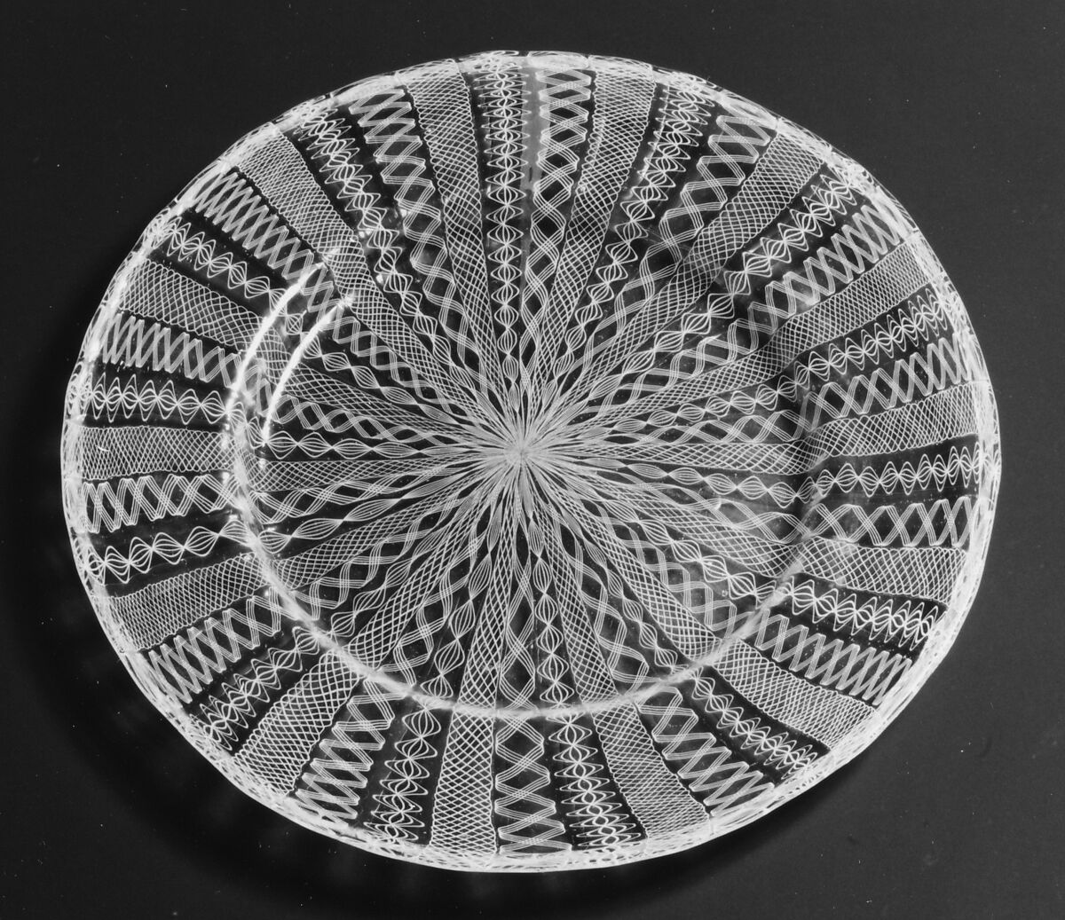 Plate, Colorless (slightly grayish tan) and opaque white nonlead glass. Blown, "vetro a retorti"., Italian (Venice)