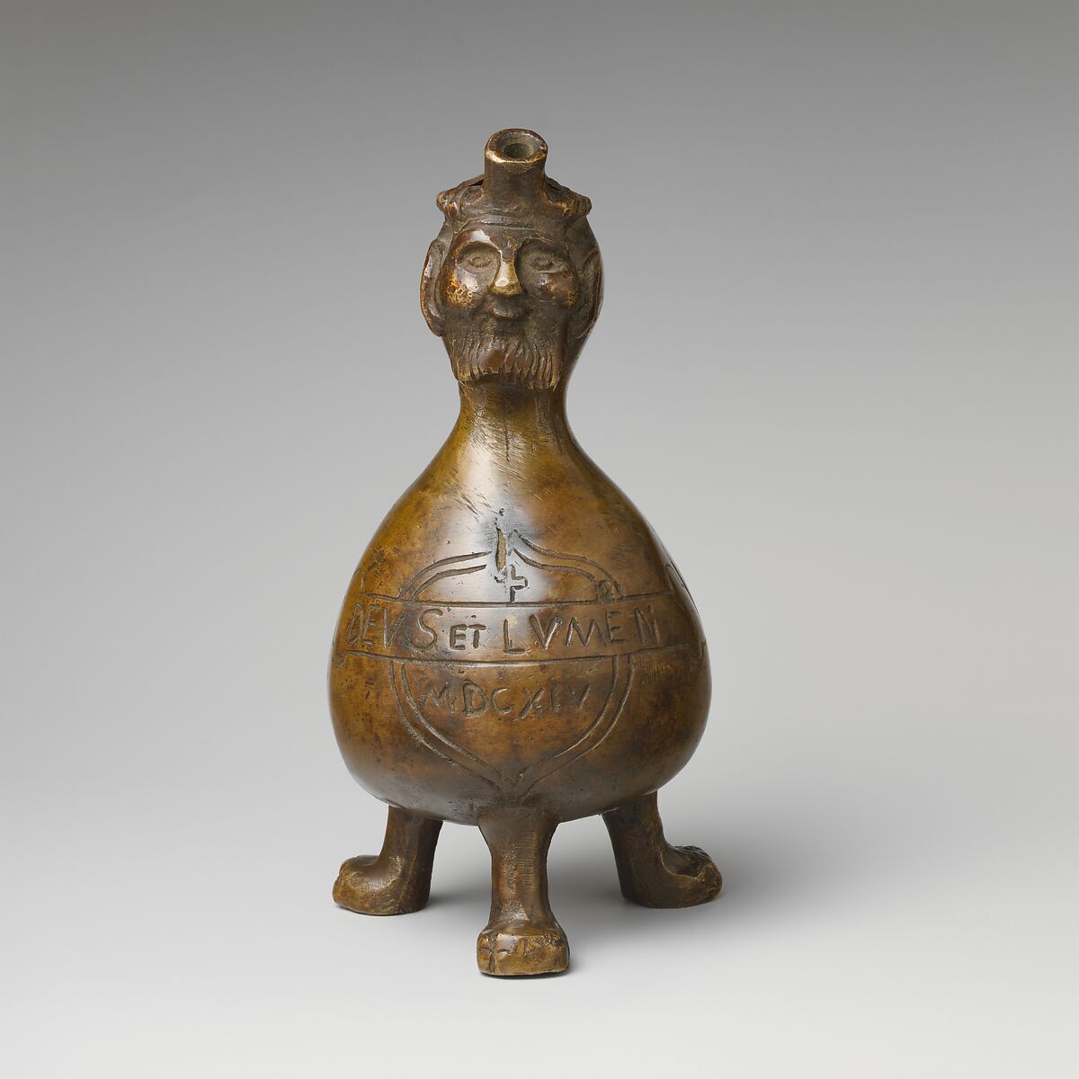 Aquamanile in the Form of a Gourd with a
Human Head, Bronze; quaternary copper alloy (62.8% copper, 18.3% lead; 11.9% zinc, 7% tin); with a thin layer of dark patina., German