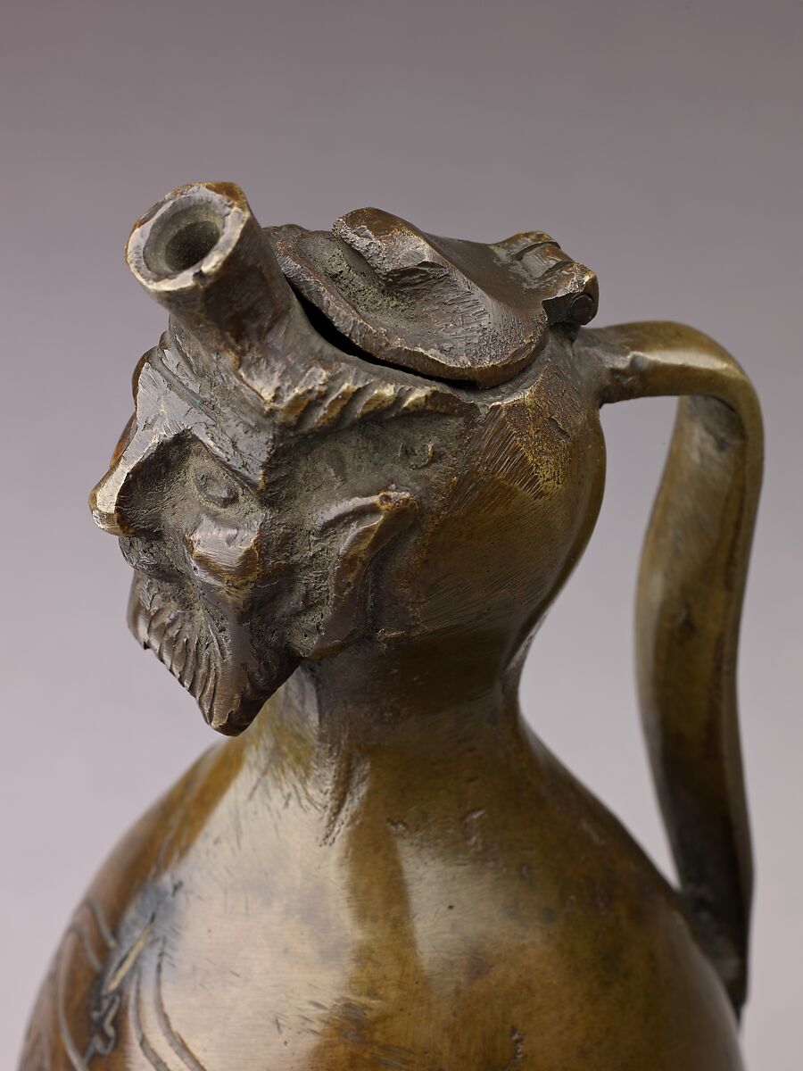 Aquamanile in the Form of a Gourd with a
Human Head, Bronze; quaternary copper alloy (62.8% copper, 18.3% lead; 11.9% zinc, 7% tin); with a thin layer of dark patina., German