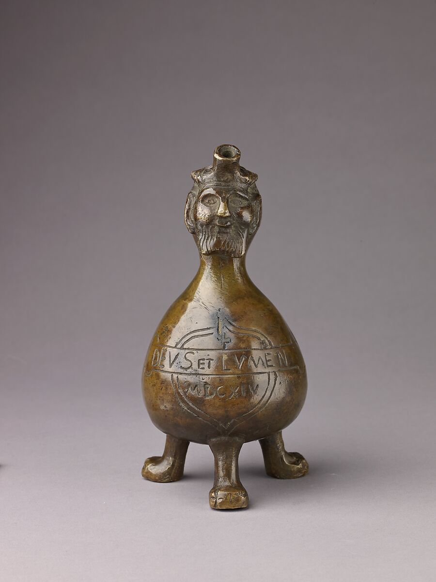 Aquamanile in the Form of a Gourd with a
Human Head, Bronze; quaternary copper alloy (62.8% copper, 18.3% lead; 11.9% zinc, 7% tin); with a thin layer of dark patina., German