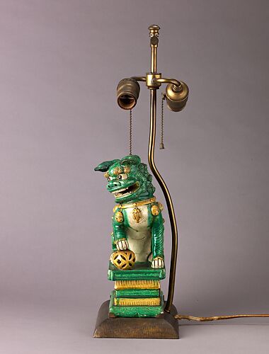 Figure of lion mounted as lamp