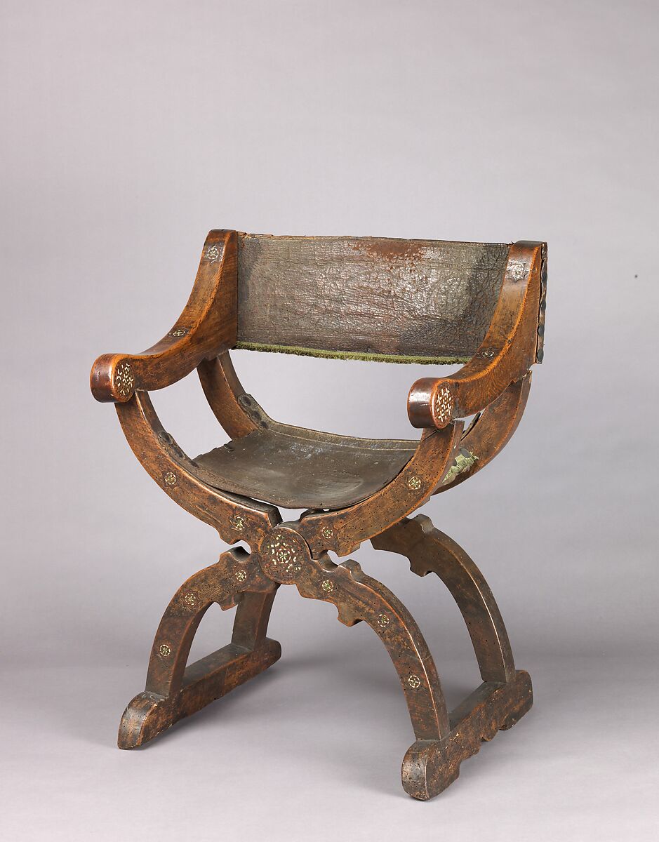 Hip-joint armchair (Dantesca type), Elm (?), bone, carved; leather (?), tooled embroidery, silk velvet, metal., Italian 