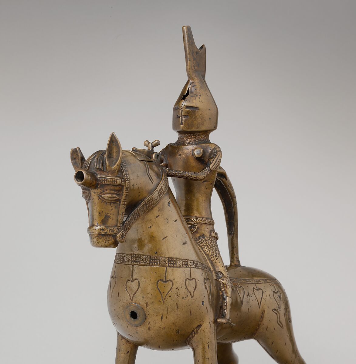 Aquamanile in the Form of a Knight on
Horseback, Bronze; Quaternary copper alloy with a high content of zinc (approx. 73% copper, approx. 15% zinc, approx. 7% lead, approx. 3% tin) with natural patina, hollow cast; remnants of the clay core
and iron armature in the legs, German, Lower Saxony (?)