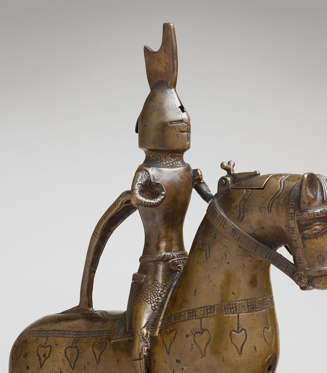Aquamanile in the Form of a Knight on
Horseback, Bronze; Quaternary copper alloy with a high content of zinc (approx. 73% copper, approx. 15% zinc, approx. 7% lead, approx. 3% tin) with natural patina, hollow cast; remnants of the clay core
and iron armature in the legs, German, Lower Saxony (?)