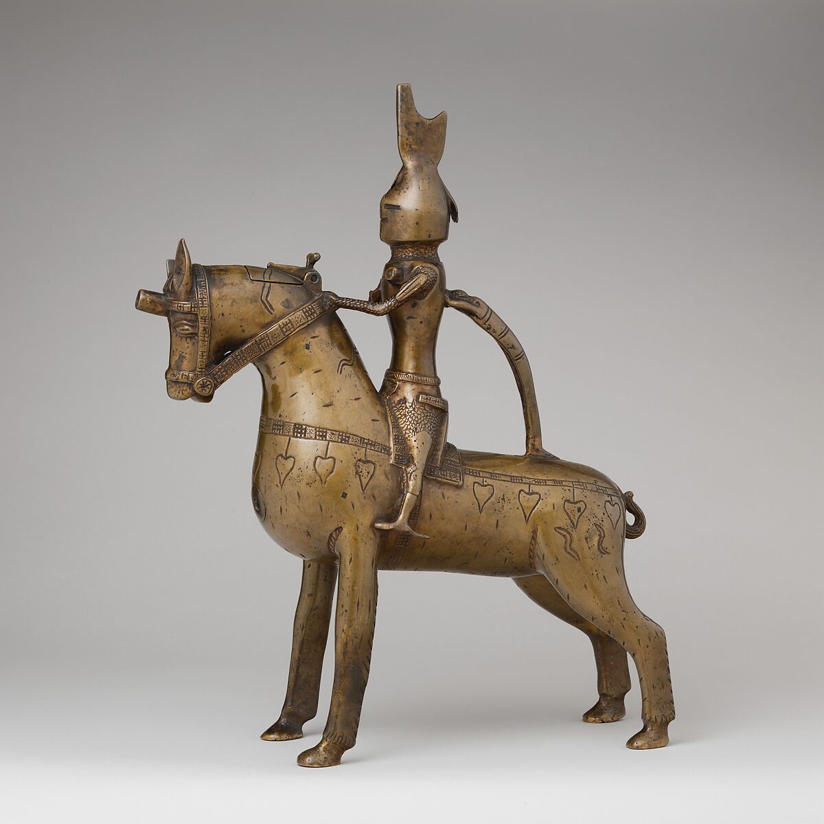 Aquamanile in the Form of a Knight on
Horseback, Bronze; Quaternary copper alloy with a high content of zinc (approx. 73% copper, approx. 15% zinc, approx. 7% lead, approx. 3% tin) with natural patina, hollow cast; remnants of the clay core
and iron armature in the legs, German, Lower Saxony (?) 