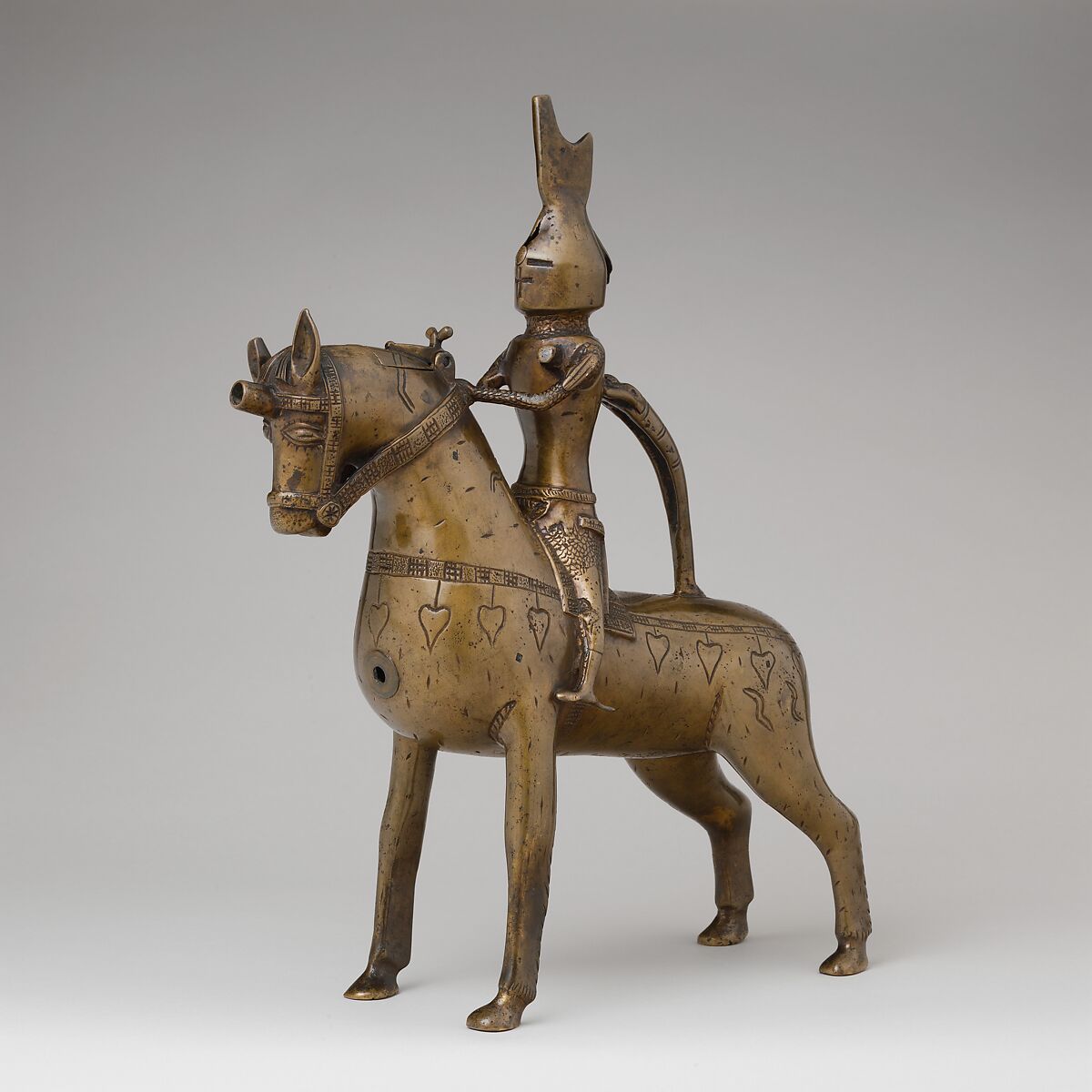 Aquamanile in the Form of a Knight on
Horseback, Bronze; Quaternary copper alloy with a high content of zinc (approx. 73% copper, approx. 15% zinc, approx. 7% lead, approx. 3% tin) with natural patina, hollow cast; remnants of the clay core
and iron armature in the legs, German, Lower Saxony (?)