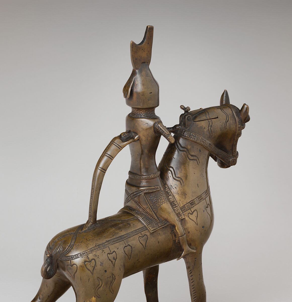 Aquamanile in the Form of a Knight on
Horseback, Bronze; Quaternary copper alloy with a high content of zinc (approx. 73% copper, approx. 15% zinc, approx. 7% lead, approx. 3% tin) with natural patina, hollow cast; remnants of the clay core
and iron armature in the legs, German, Lower Saxony (?)