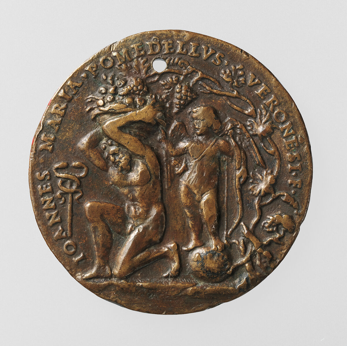 Portrait medal of an Unknown Lady (obverse); A Kneeling Man with a Basket of Fruit, Cupid, and the Caduceus of Mercury (reverse), Giovanni Maria Pomedelli (Italian, Villafranca di Verona 1478–1537), Bronze (copper alloy with a light brown
patina under a worn reddish brown layer of wax or lacquer)