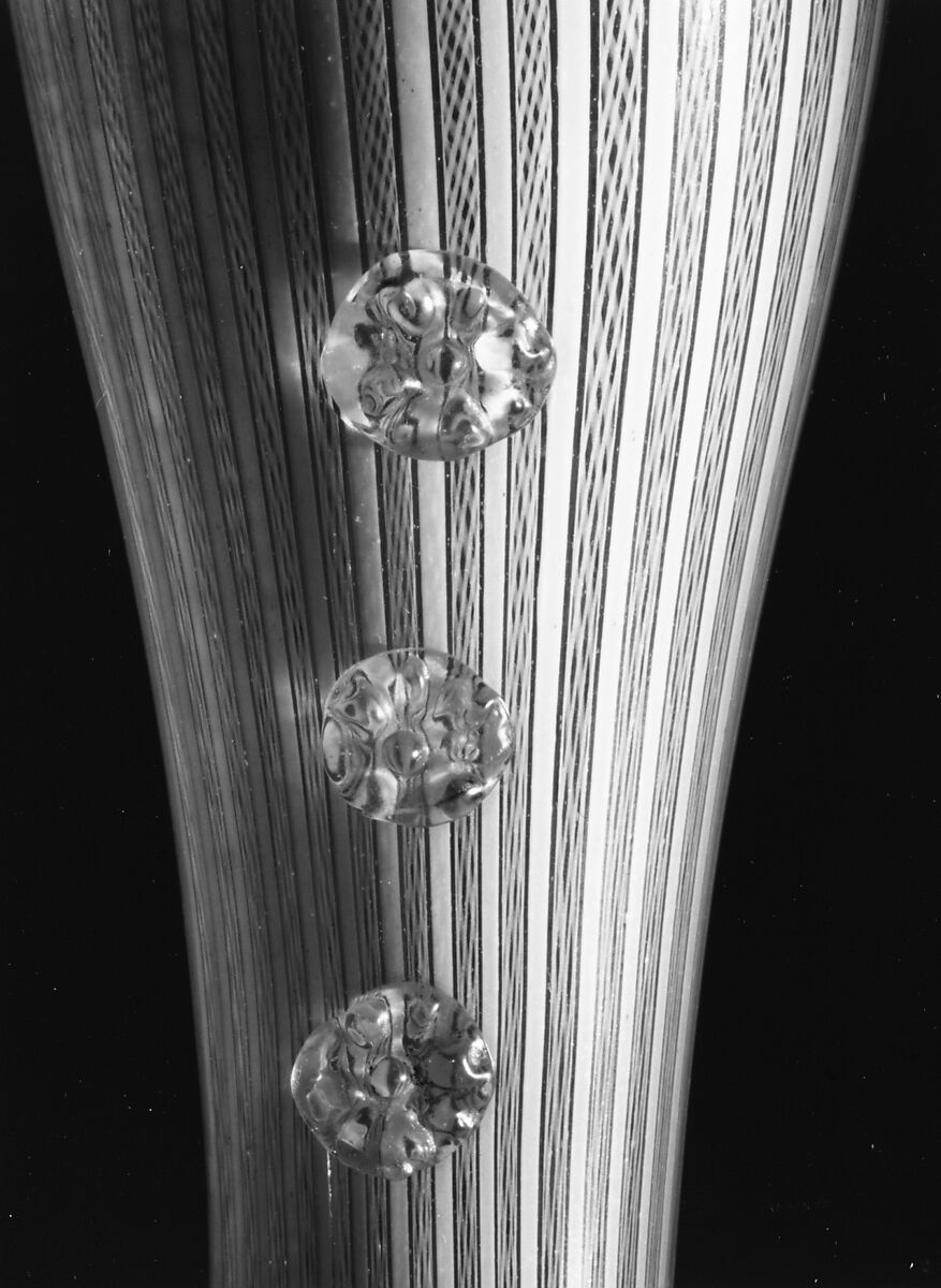 Boot glass, Colorless (gray) and opaque white nonlead glass. Blown, "vetro a retorti", trailed, applied and impressed parts, gilt., Venetian or façon de Venise, probably south Lowlands or Germany