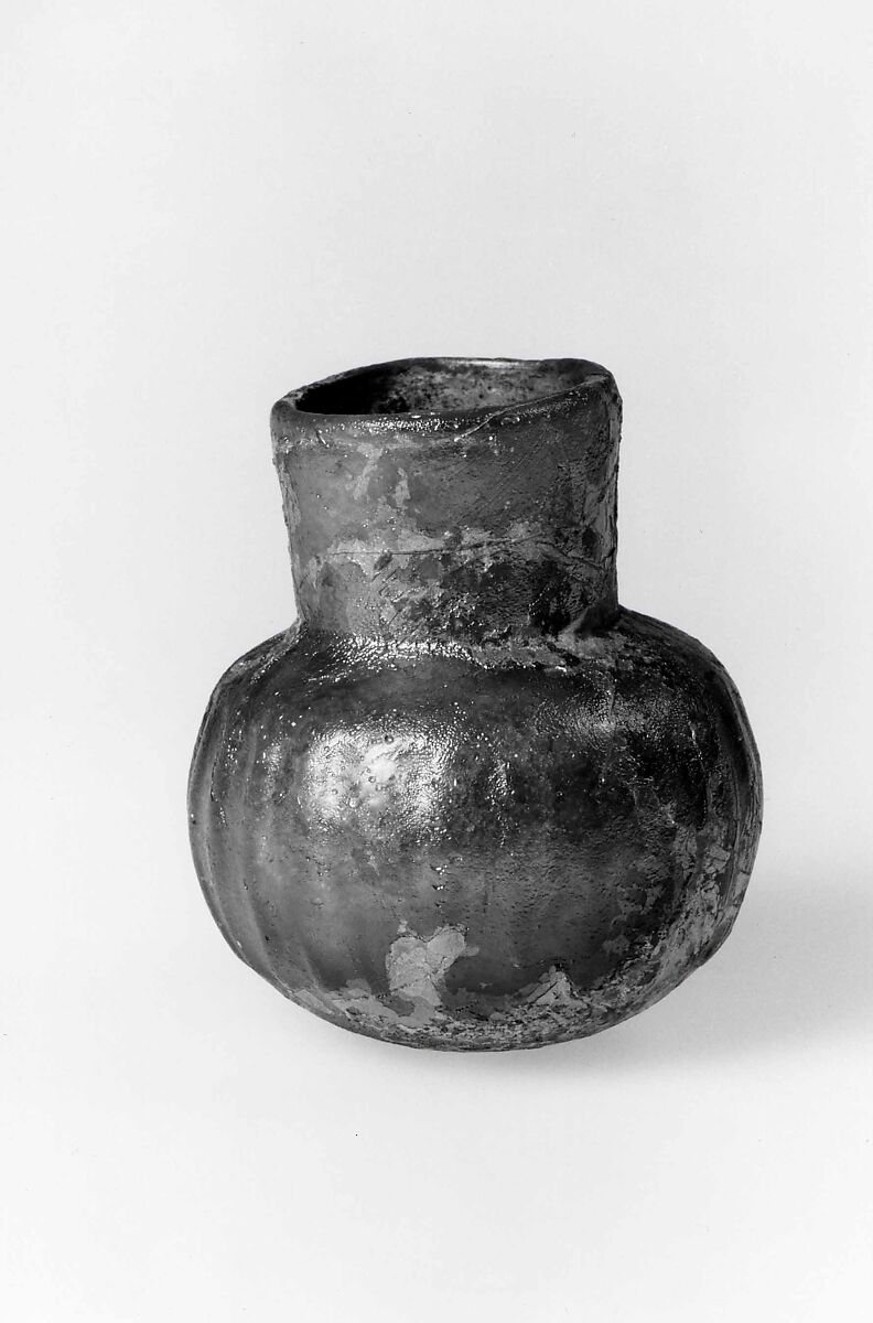 Jar, Probably almost colorless glass. Blown (the body blown in a dip mold), the rim finished at the furnace., Islamic 