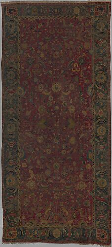 Indo-Persian carpet with vine scroll and palmette pattern