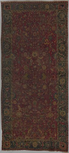 Indo-Persian carpet with vine scroll and palmette pattern