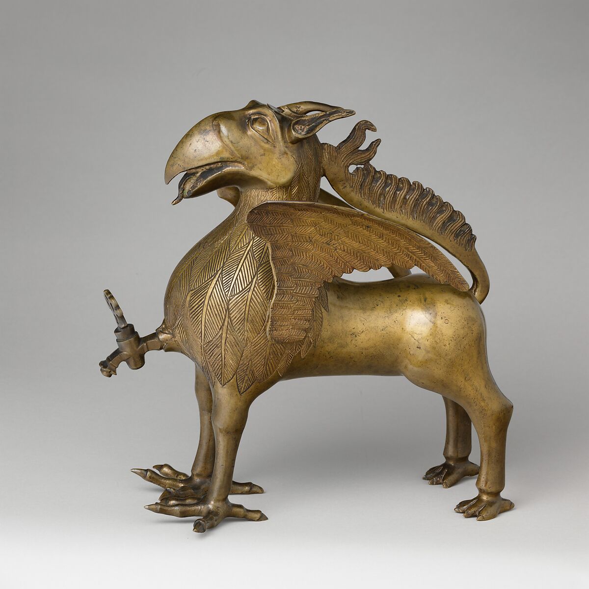 Aquamanile in the Form of a Griffin, Bronze; Ternary copper alloy with a very high content of zinc (approx. 74%
copper, approx. 22% zinc, approx. 2% lead) with natural patina, hollow cast., German, Nuremberg