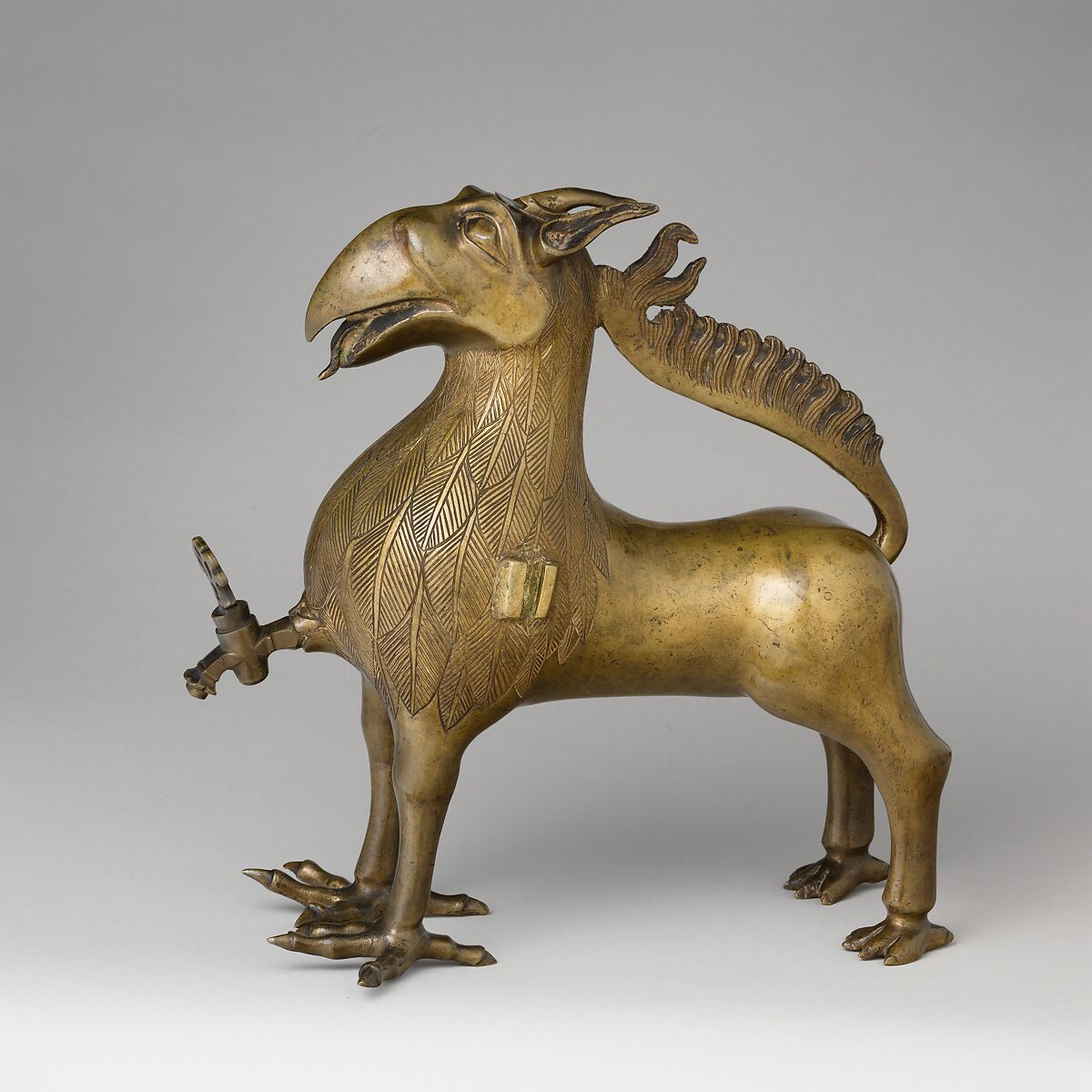 Aquamanile in the Form of a Griffin, Bronze; Ternary copper alloy with a very high content of zinc (approx. 74%
copper, approx. 22% zinc, approx. 2% lead) with natural patina, hollow cast., German, Nuremberg 