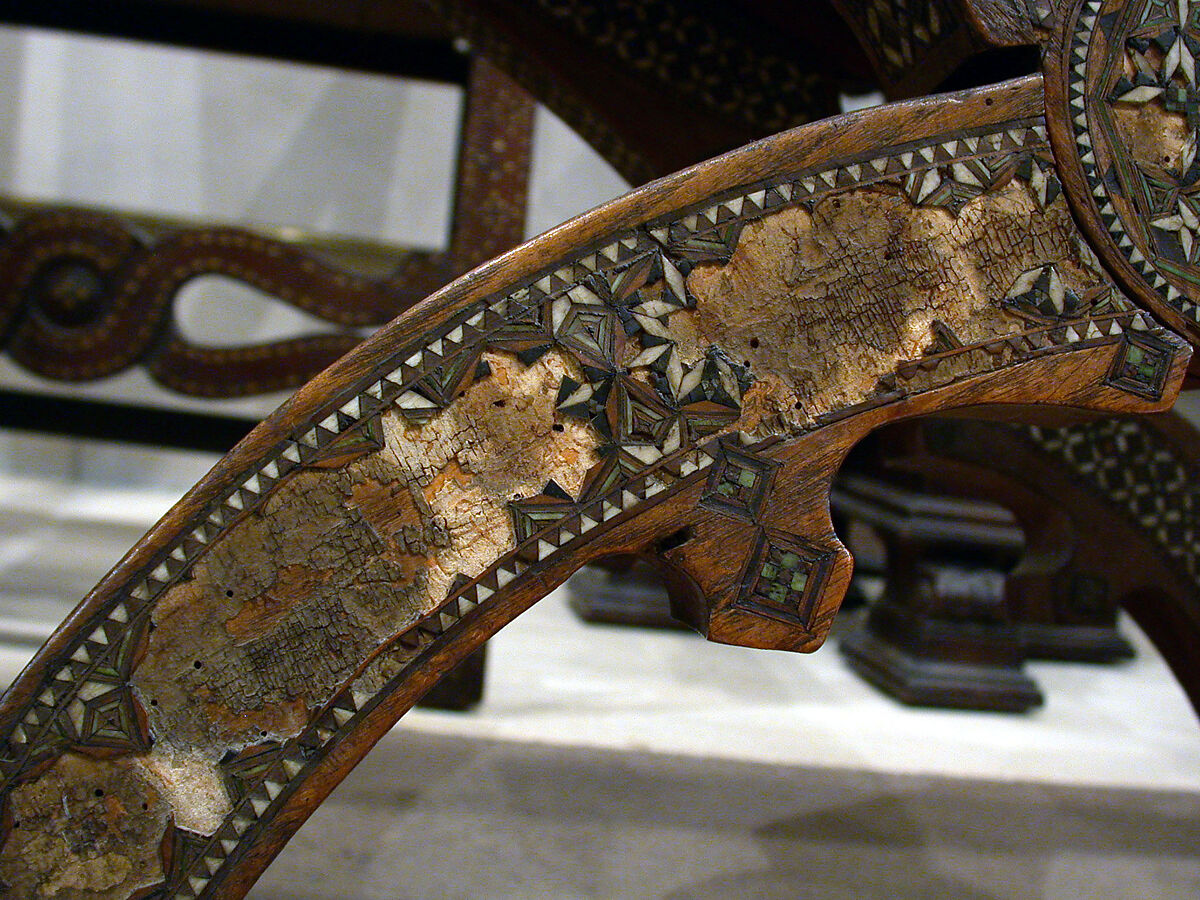 Hip-joint armchair (sillón de cadera or jamuga), Walnut, elm, other woods, ivory, mother-of-pearl, pewter, parchment; leather, tooled., Spanish (Granada?), Hispano-Moresque