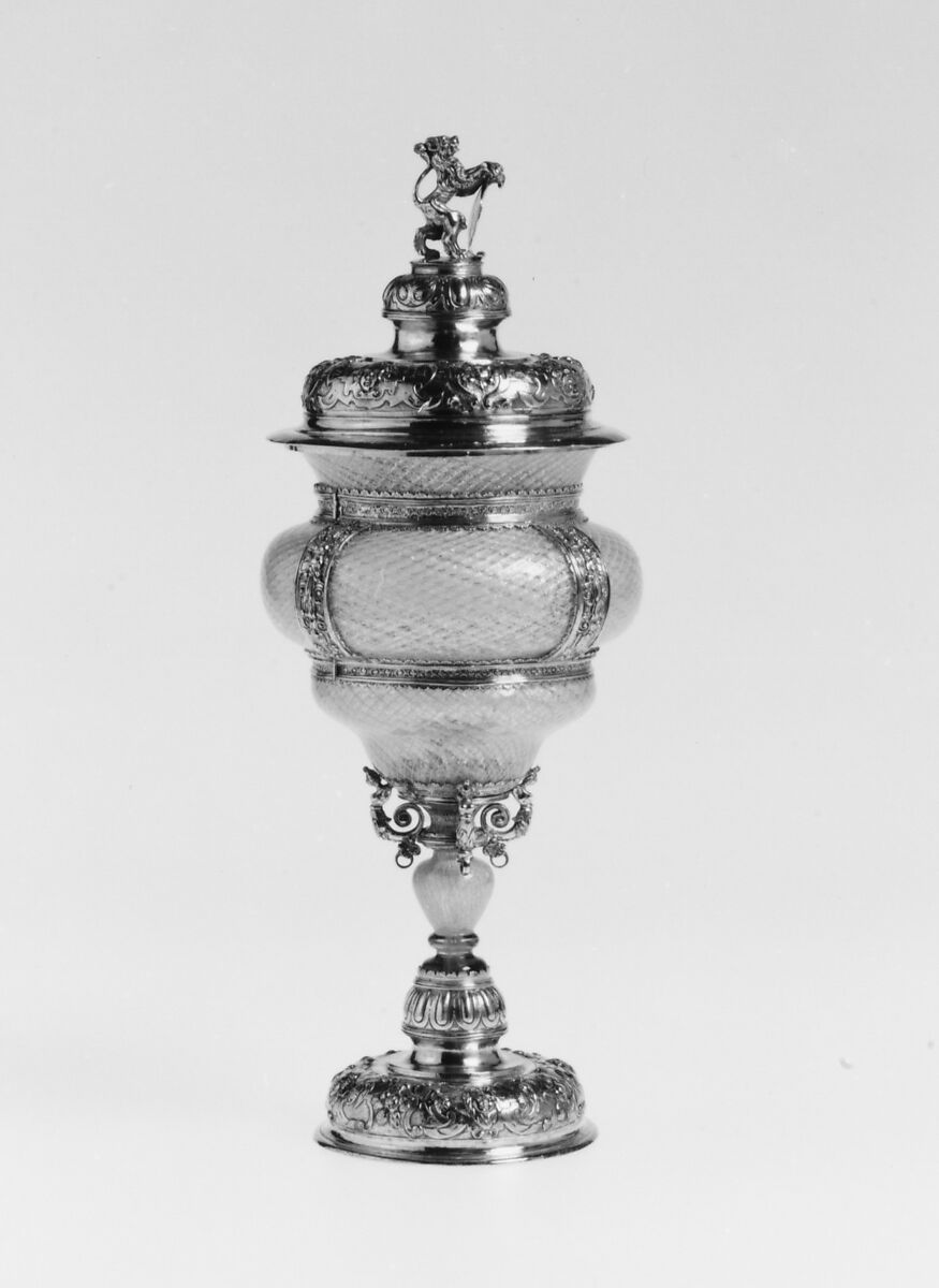 Covered goblet, Colorless (slightly gray) and opaque white nonlead glass. Blown, "vetro a reticello", silver foil; silver-gilt mounts., probably Italian (Venice); mounts probably German (Augsburg)