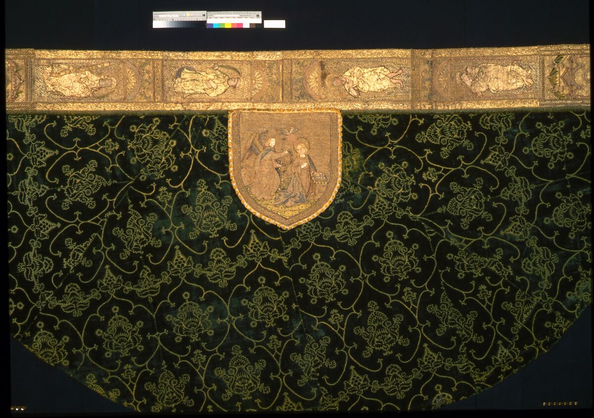 Cope with an Orphrey and a Hood, Cope:  silk warp-float faced 4/1 satin weave with linen plain weave lining.
Orphrey:  linen plain weave with silk and gilt- and silvered- metal strip wrapped silk in satin and split stitches, laid work, couching, and padded couching.  Fringe:  silk, gilt-metal-strip-wrapped silk.  Lining: cotton plain weave.
Hood:  linen plain weave embroidered with silk, gilt- and silvered- metal-strip-wrapped silk, and silvered-metal strips and coils , couching and couching padded with hemp; metal spangles.  Fringe: silk plain weave.  Lining: linen plain weave., Italian, German, Dutch, Spanish