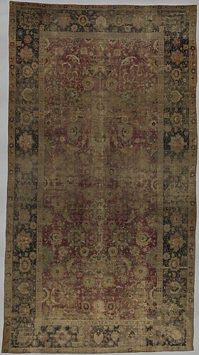 Indo-Persian carpet with vine scroll and palmette pattern