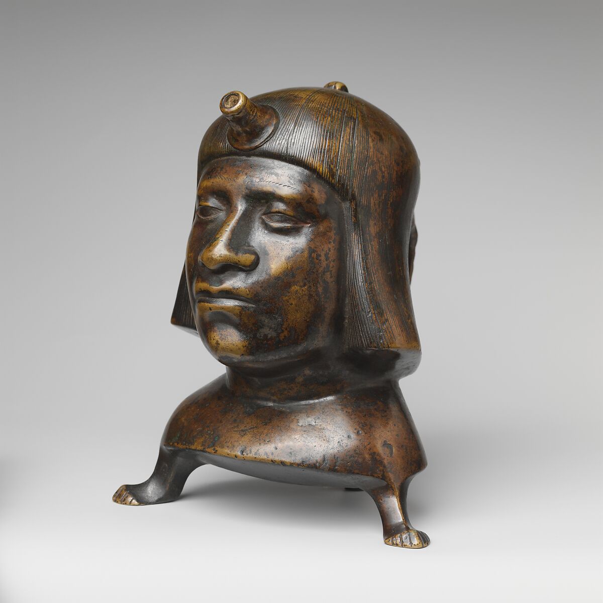 Aquamanile in the Form of a Human Head, Bronze; Ternary copper alloy with a very high percentage of zinc (approx. 68% copper,
approx. 26% zinc, approx. 4% tin), covered with a thin black lacquer patina; traces of cinnabar have been detected on the interior and exterior of the vessel., German or French, Paris (in fourteenth-century Hildesheim style)