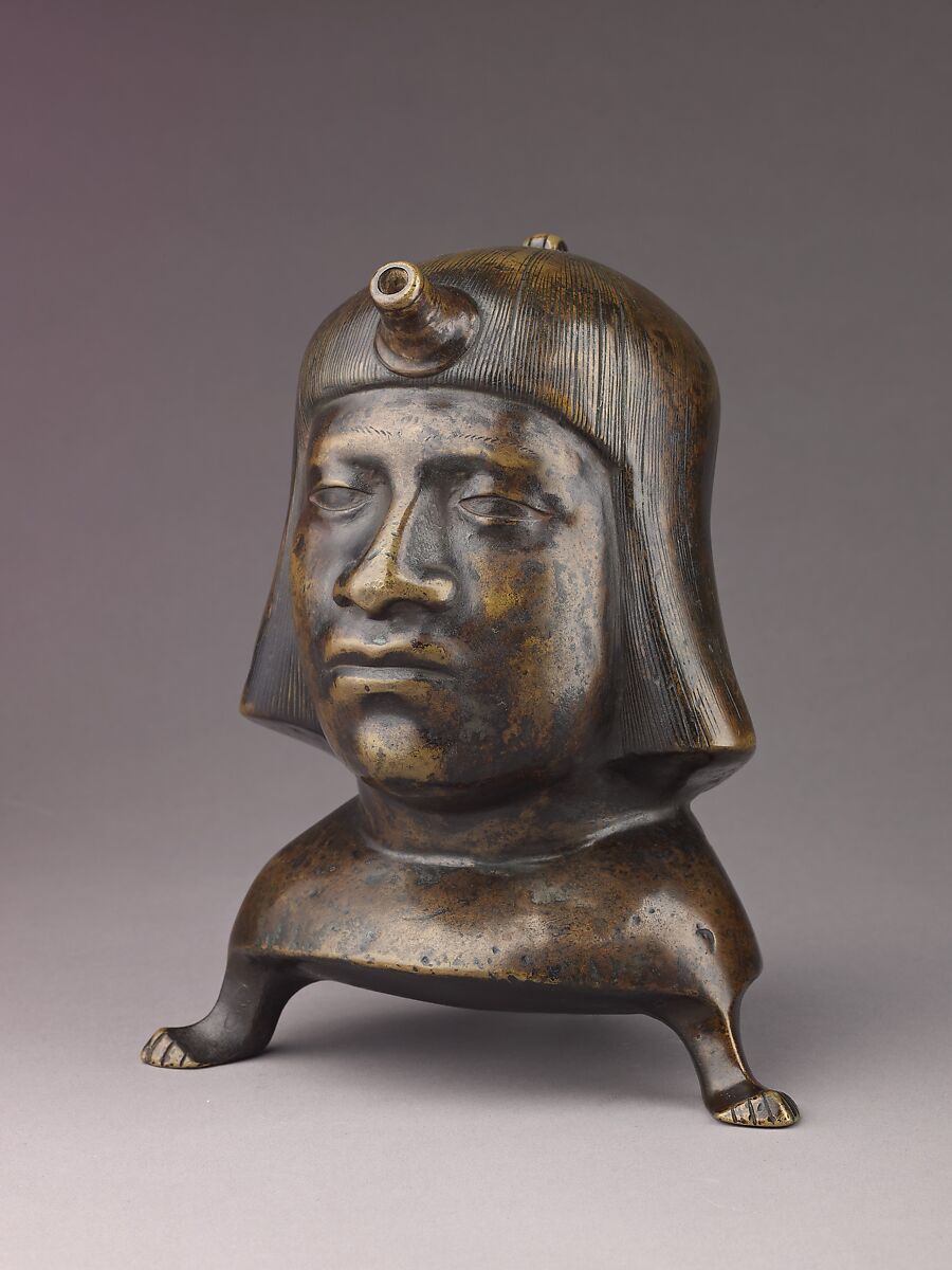 Aquamanile in the Form of a Human Head, Bronze; Ternary copper alloy with a very high percentage of zinc (approx. 68% copper,
approx. 26% zinc, approx. 4% tin), covered with a thin black lacquer patina; traces of cinnabar have been detected on the interior and exterior of the vessel., German or French, Paris (in fourteenth-century Hildesheim style)