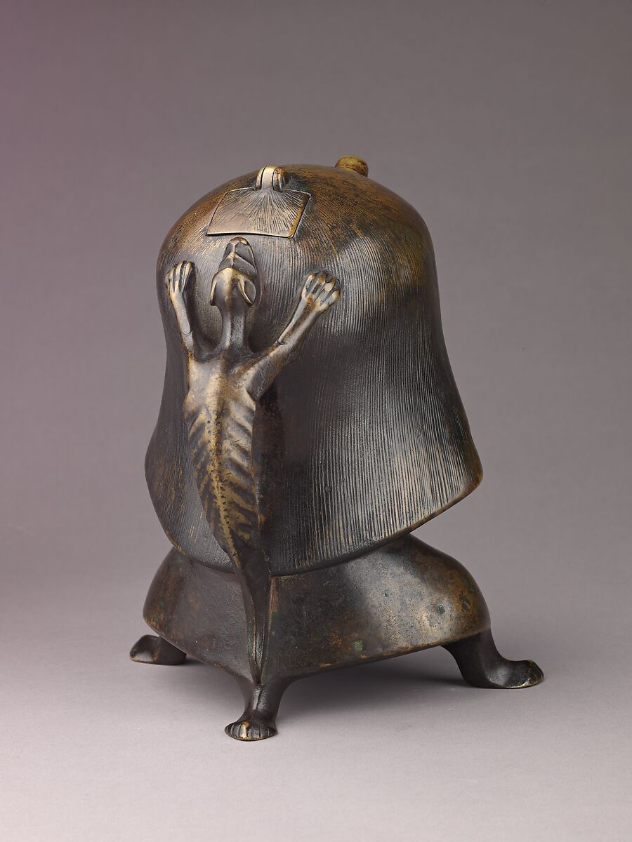 Aquamanile in the Form of a Human Head, Bronze; Ternary copper alloy with a very high percentage of zinc (approx. 68% copper,
approx. 26% zinc, approx. 4% tin), covered with a thin black lacquer patina; traces of cinnabar have been detected on the interior and exterior of the vessel., German or French, Paris (in fourteenth-century Hildesheim style)