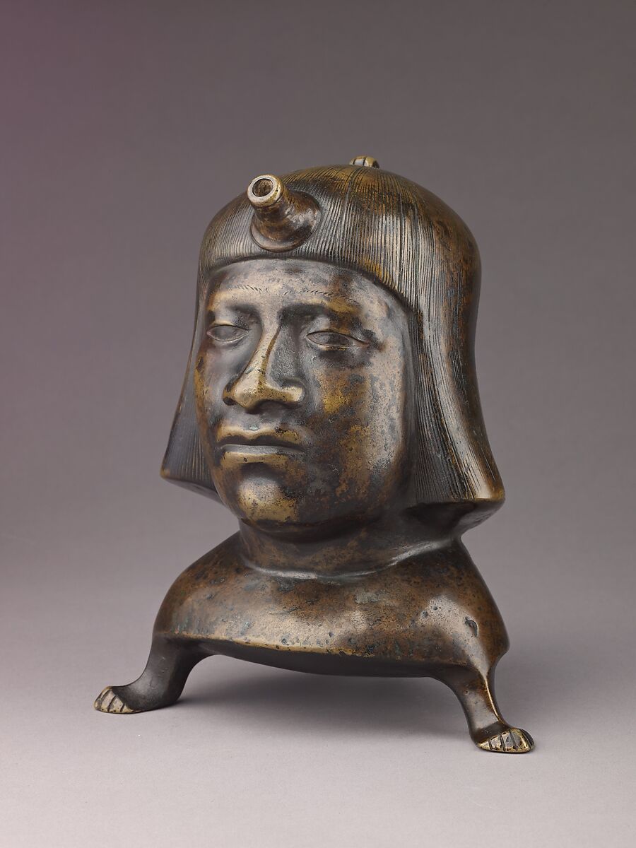 Aquamanile in the Form of a Human Head, Bronze; Ternary copper alloy with a very high percentage of zinc (approx. 68% copper,
approx. 26% zinc, approx. 4% tin), covered with a thin black lacquer patina; traces of cinnabar have been detected on the interior and exterior of the vessel., German or French, Paris (in fourteenth-century Hildesheim style)